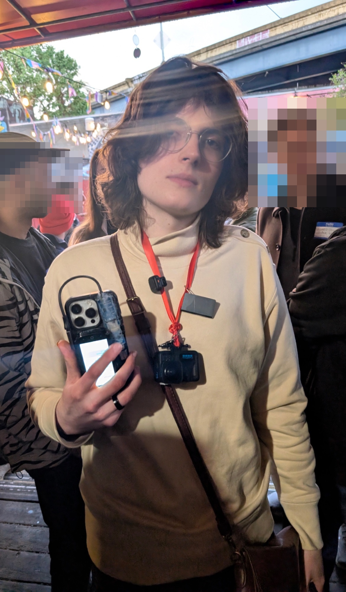 someone wearing a bodycamera and holding a phone